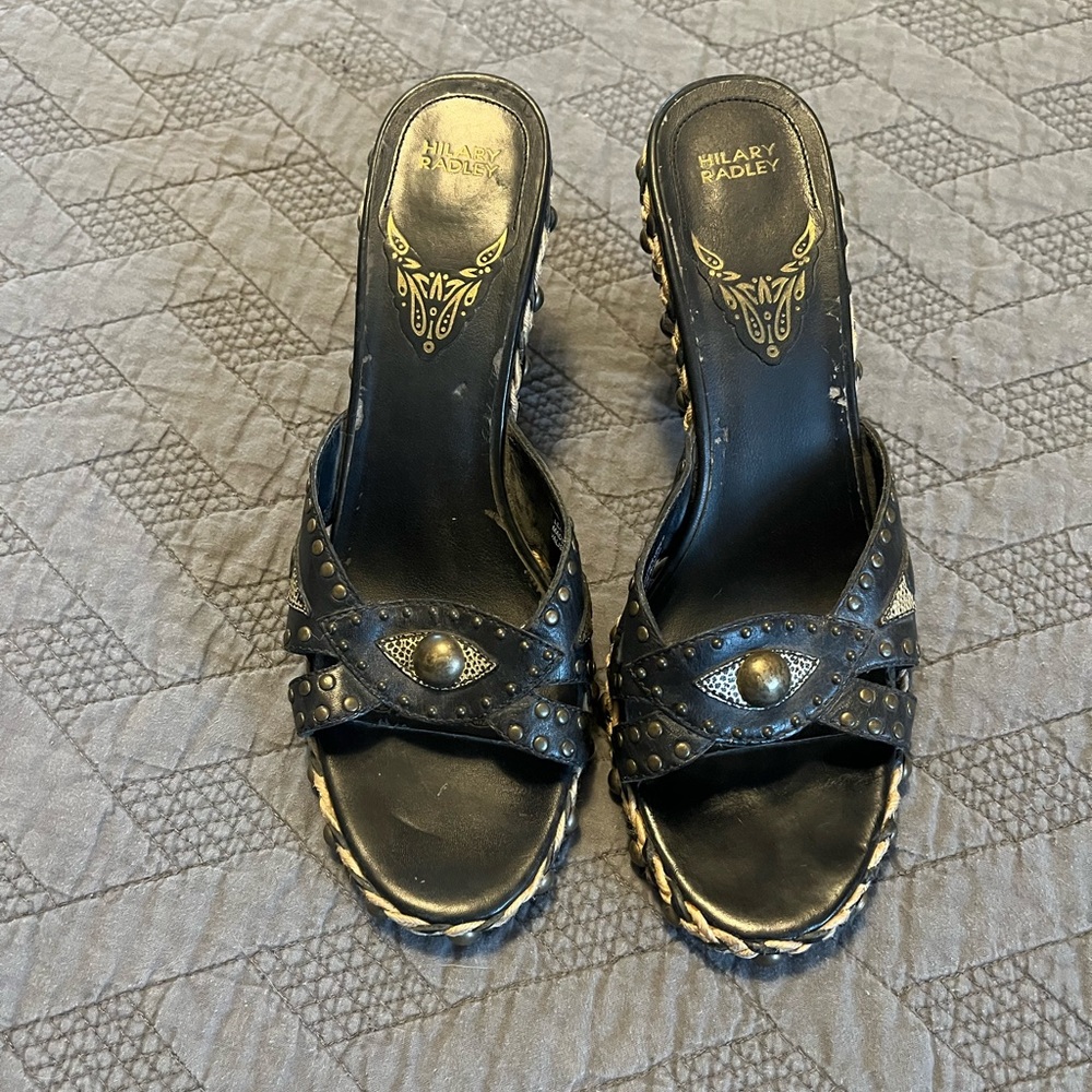 Black and tan heels with brass accents